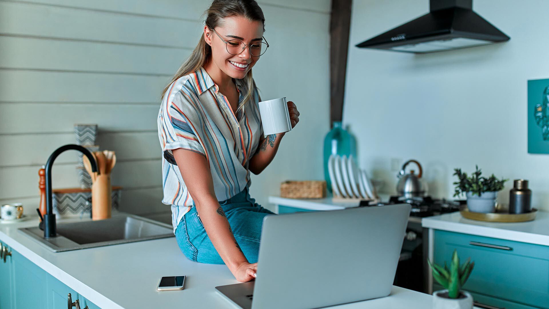 woman shopping on computer and drinking coffee woman shopping on computer and drinking coffee